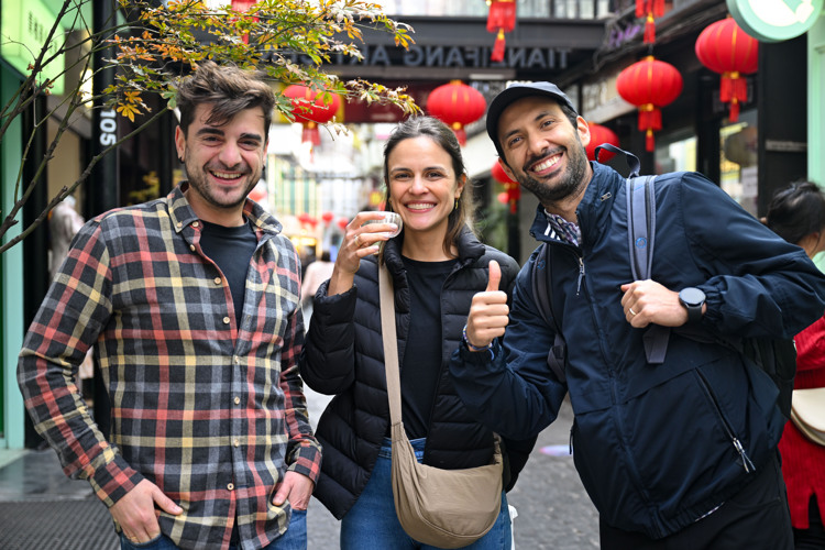 Tourists from Spain visit Tianzifang, an art area in east China's Shanghai. (Photo by Chen Haoming/Xinhua)