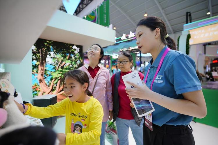 A girl learns about cultural and creative products at an exhibition area featuring "sojourning in Yunnan" at the 9th China-South Asia Expo in Kunming, southwest China's Yunnan Province, June 20, 2025.(Xinhua/Gao Yongwei) 938fced0d5646bc91e1a23391bc6359f.jpeg
