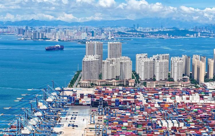 This aerial drone photo taken on July 8, 2025 shows a container ship approaching to Qingdao Port in Qingdao, east China's Shandong Province. (Photo by Zhang Jingang/Xinhua) 36028921c41e0e1ca0bec09cb153e81c.jpeg
