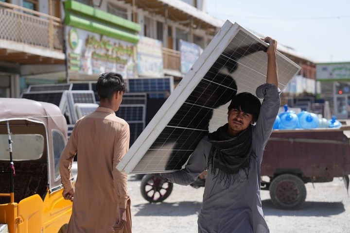 A man unloads solar panels from a truck outside a solar equipment store in Kabul, Afghanistan, July 29, 2026. (Photo by Saifurahman Safi/Xinhua) d43febc44fa9f711dd7e05a633f341e3.jpeg